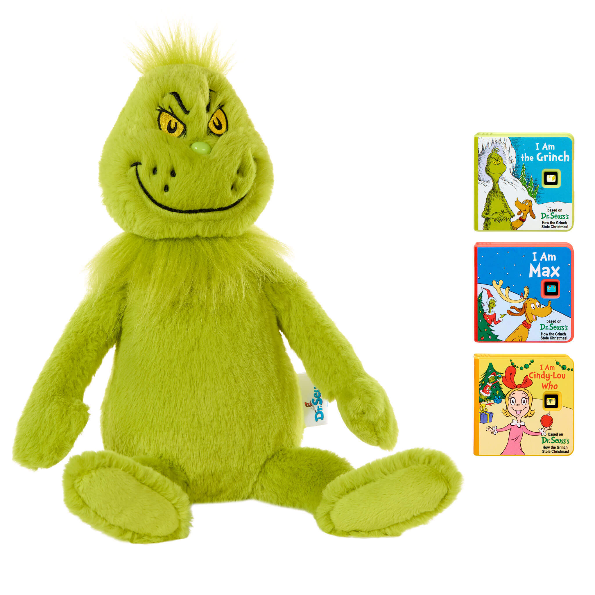 Grinch plush toy with three books on a white background